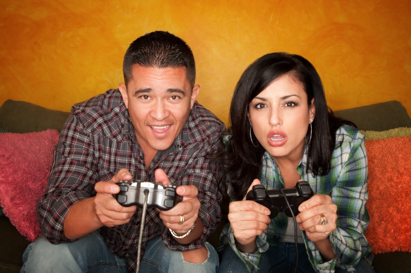 1172877-hispanic-couple-playing-video-game